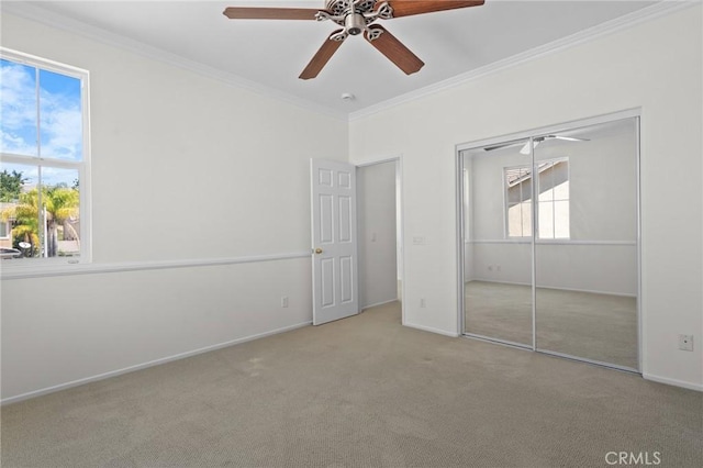 24058 Via Vis, Valencia, CA 91354 - unfurnished bedroom with carpet, ornamental molding, a ceiling fan, and a closet