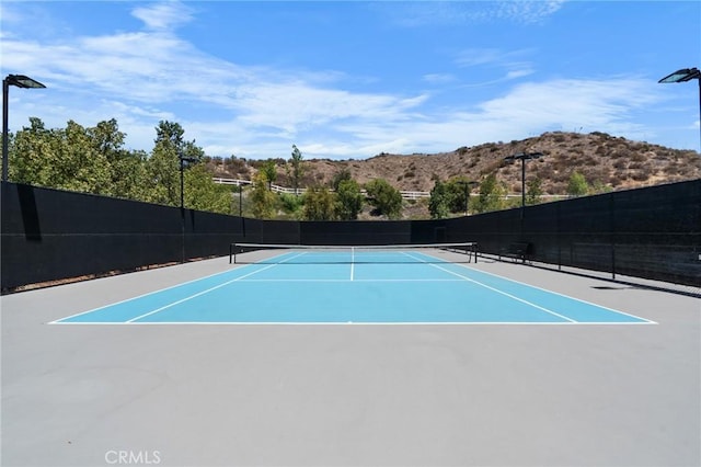 24058 Via Vis, Valencia, CA 91354 - view of tennis court with community basketball court and a mountain view