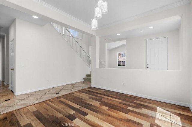 24058 Via Vis, Valencia, CA 91354 - unfurnished living room with crown molding, hardwood / wood-style floors, stairway, and recessed lighting
