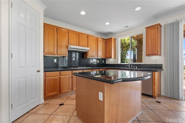 24058 Via Vis, Valencia, CA 91354 - kitchen featuring under cabinet range hood, light tile patterned floors, appliances with stainless steel finishes, decorative backsplash, and recessed lighting