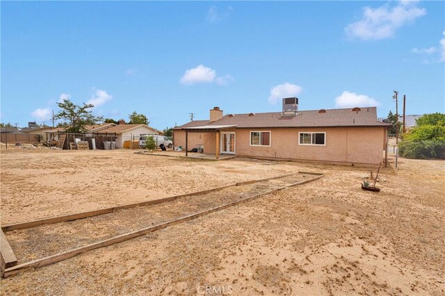 8960 Buckthorn Ave, Hesperia, CA 92345 - back of property with a patio area and stucco siding