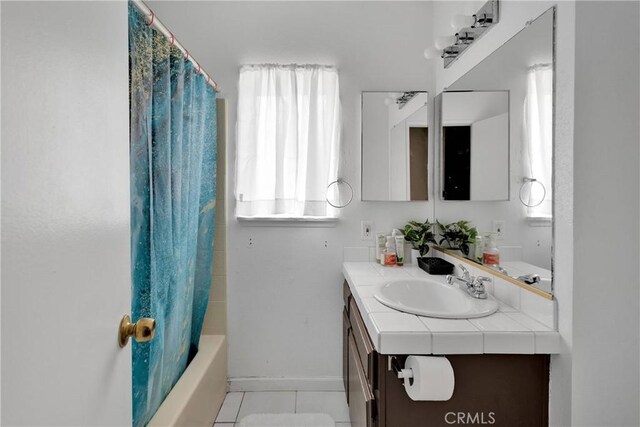 8960 Buckthorn Ave, Hesperia, CA 92345 - bathroom featuring vanity, tile patterned floors, and shower / bathtub combination with curtain