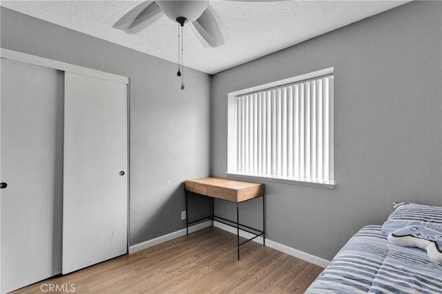 8960 Buckthorn Ave, Hesperia, CA 92345 - bedroom with wood finished floors and a ceiling fan