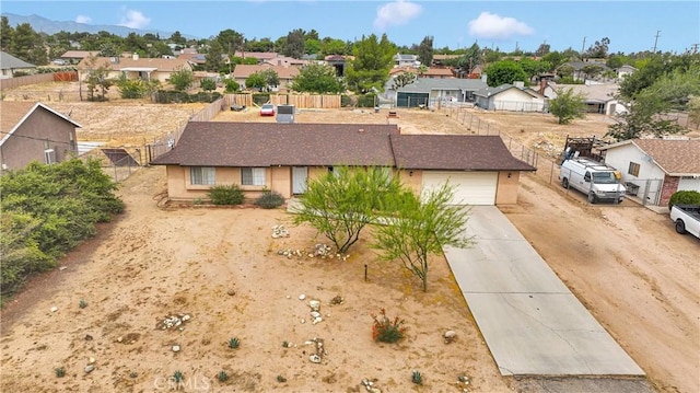 8960 Buckthorn Ave, Hesperia, CA 92345 - single story home with a residential view, concrete driveway, stucco siding, and a garage