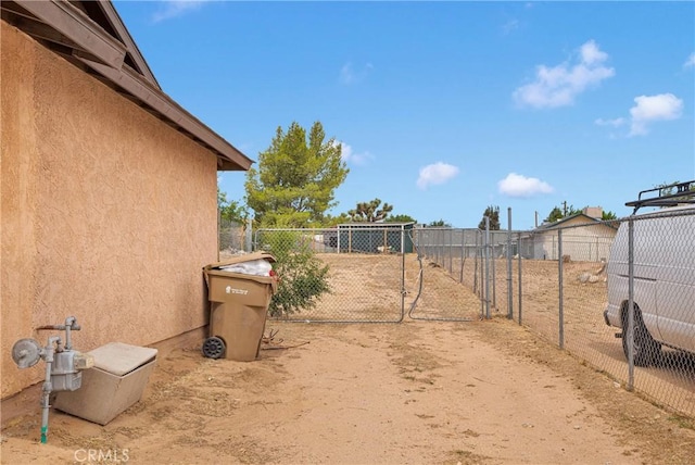 8960 Buckthorn Ave, Hesperia, CA 92345 - view of yard featuring a gate