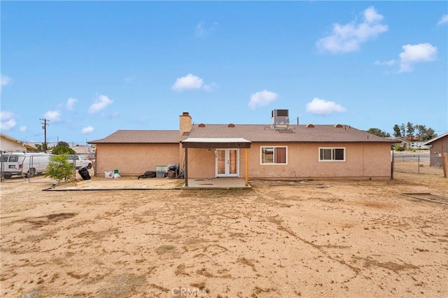 8960 Buckthorn Ave, Hesperia, CA 92345 - rear view of house with french doors, a patio area, and stucco siding
