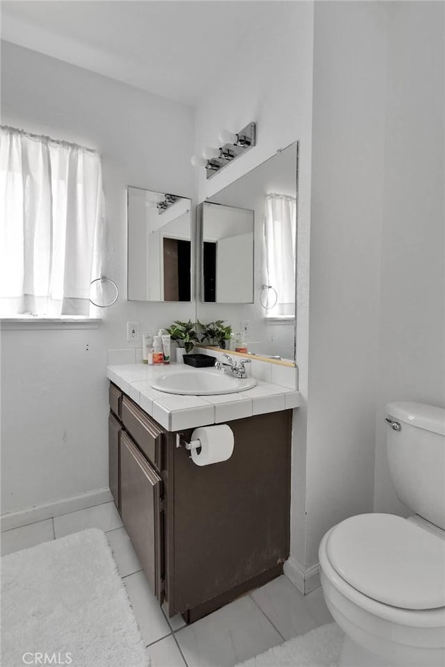 8960 Buckthorn Ave, Hesperia, CA 92345 - bathroom featuring healthy amount of natural light, vanity, and tile patterned flooring