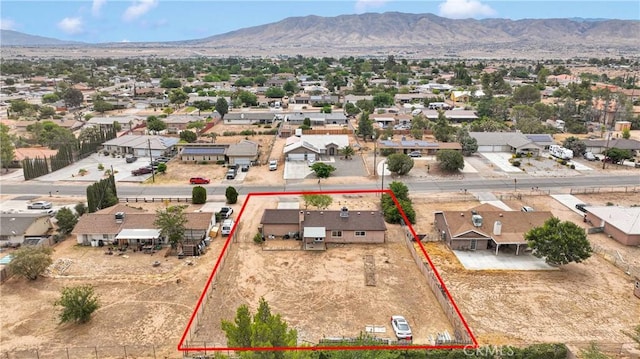 8960 Buckthorn Ave, Hesperia, CA 92345 - aerial view of residential area with property parcel outlined and a mountainous background