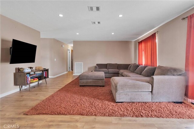 8960 Buckthorn Ave, Hesperia, CA 92345 - living area featuring light wood-style flooring and recessed lighting