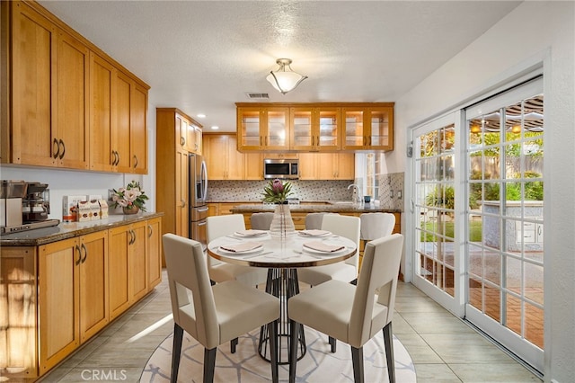1722 Calle Alto, San Dimas, CA 91773 - dining area with light tile patterned floors, a textured ceiling, and recessed lighting