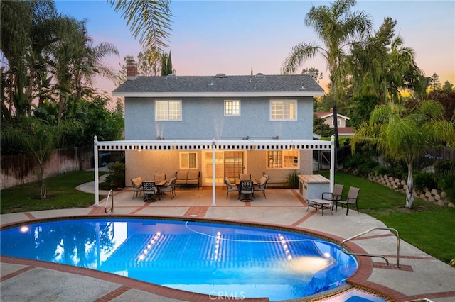 1722 Calle Alto, San Dimas, CA 91773 - back of property featuring a fenced backyard, stucco siding, a patio, and an outdoor hangout area