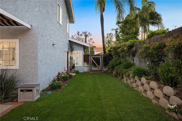 1722 Calle Alto, San Dimas, CA 91773 - yard at dusk featuring a gate and a fenced backyard