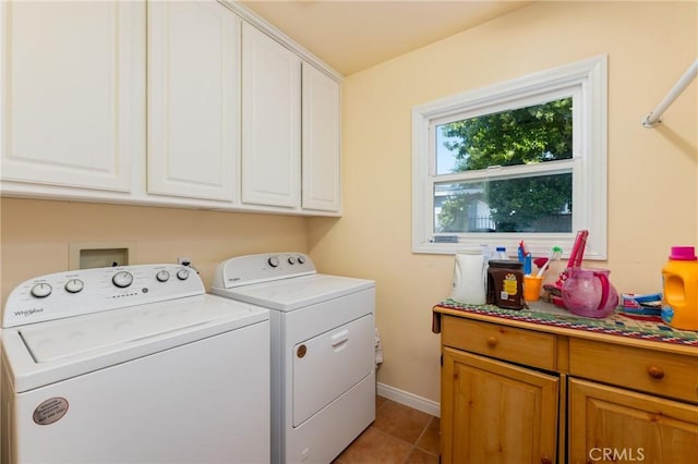 1117 Gladstone St, La Verne, CA 91750 - laundry area with washer and clothes dryer, cabinet space, and light tile patterned flooring