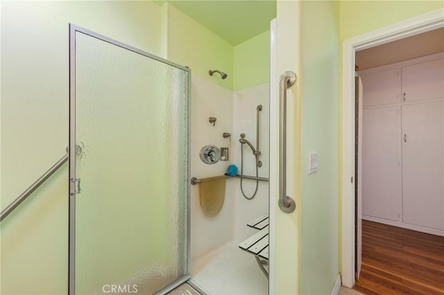 1117 Gladstone St, La Verne, CA 91750 - bathroom with a shower stall and wood finished floors