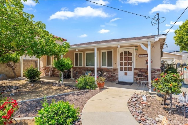 1117 Gladstone St, La Verne, CA 91750 - entrance to property featuring stucco siding, stone siding, and a porch