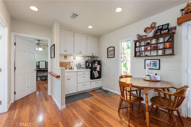 1117 Gladstone St, La Verne, CA 91750 - kitchen featuring light wood-style floors, white cabinetry, recessed lighting, ceiling fan, and light countertops