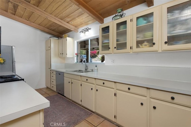3331 Via Altamira, Fallbrook, CA 92028 - kitchen featuring a wooden ceiling with exposed beams, stainless steel appliances, cream cabinets, light countertops, and light tile patterned floors