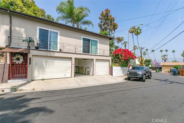 3432 Larissa Dr, Los Angeles, CA 90026 - view of front of property featuring stucco siding and a garage