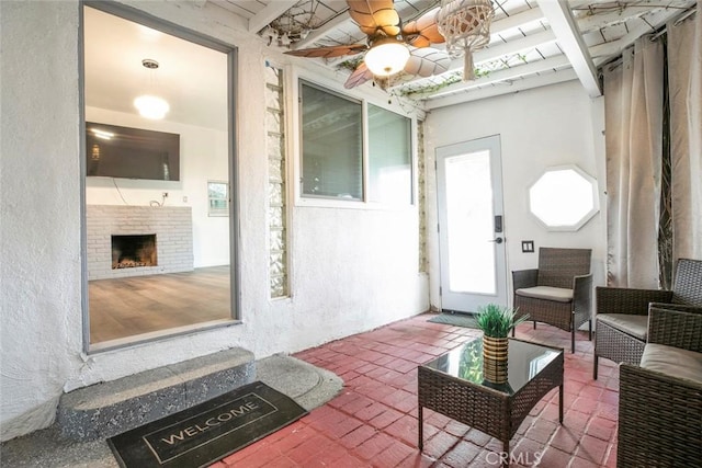 3432 Larissa Dr, Los Angeles, CA 90026 - living area featuring brick flooring, a fireplace, and a textured wall