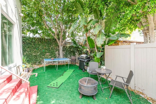 3432 Larissa Dr, Los Angeles, CA 90026 - fenced backyard with an outdoor fire pit