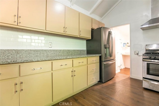 3432 Larissa Dr, Los Angeles, CA 90026 - kitchen featuring wall chimney exhaust hood, appliances with stainless steel finishes, cream cabinets, lofted ceiling, and dark wood-style flooring