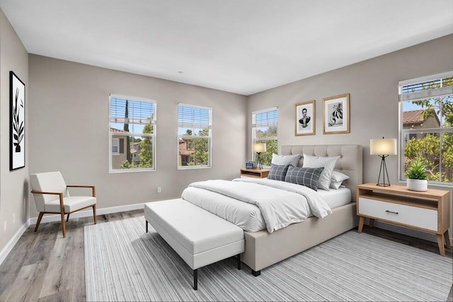 13325 Via Tresca Unit 7, San Diego, CA 92129 - bedroom with light wood-style flooring and baseboards