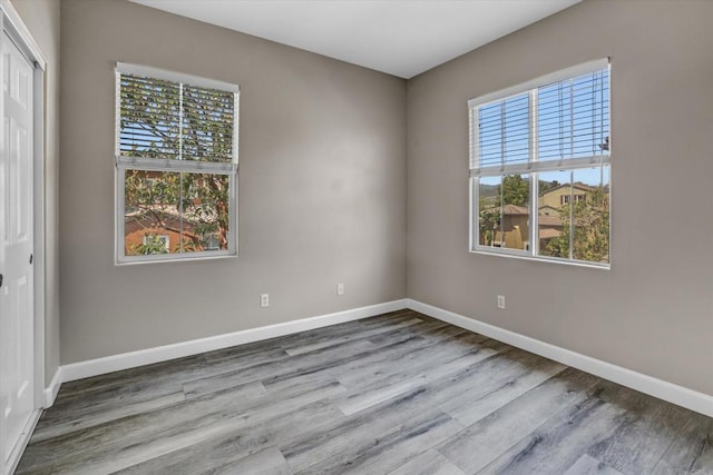 13325 Via Tresca Unit 7, San Diego, CA 92129 - unfurnished room featuring baseboards and wood finished floors
