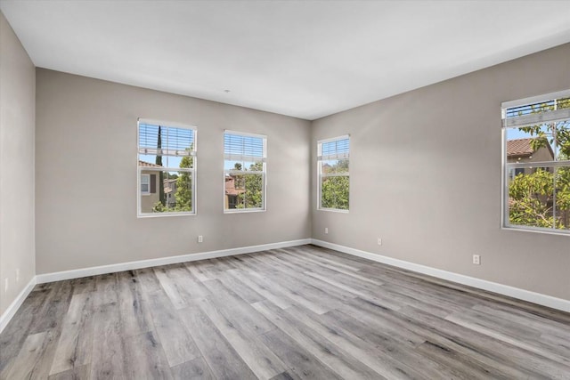 13325 Via Tresca Unit 7, San Diego, CA 92129 - empty room featuring wood finished floors and baseboards