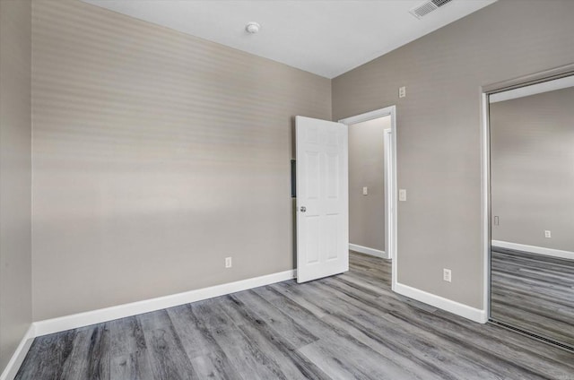 13325 Via Tresca Unit 7, San Diego, CA 92129 - unfurnished bedroom featuring wood finished floors and baseboards