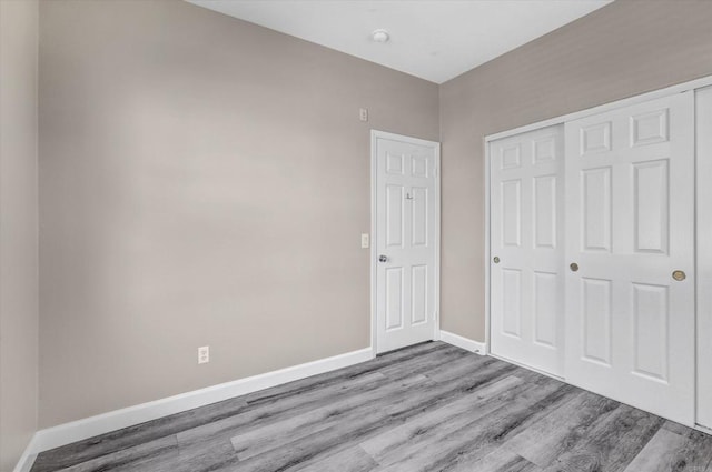 13325 Via Tresca Unit 7, San Diego, CA 92129 - unfurnished bedroom featuring wood finished floors and a closet