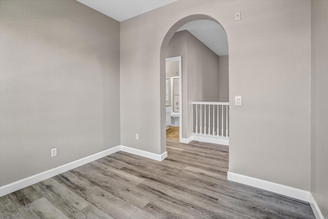 13325 Via Tresca Unit 7, San Diego, CA 92129 - unfurnished room with arched walkways and wood finished floors