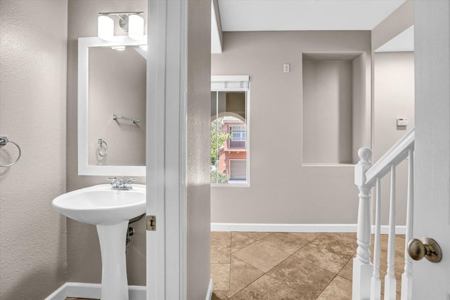 13325 Via Tresca Unit 7, San Diego, CA 92129 - bathroom with baseboards and a sink