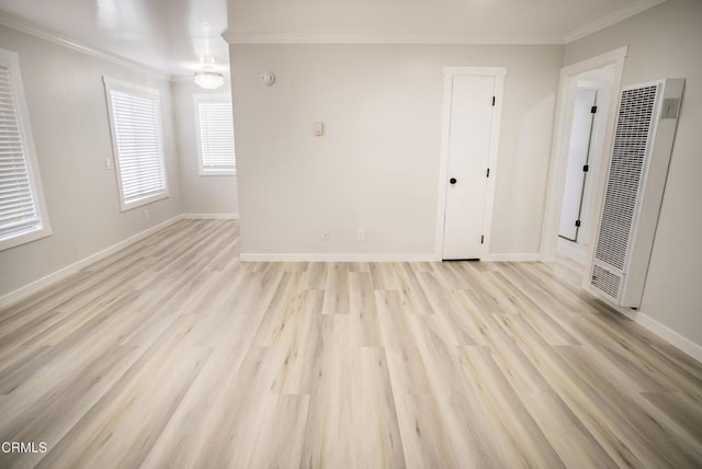 1925 Ginger St Unit 112, Oxnard, CA 93036 - unfurnished room with a heating unit, crown molding, light wood-type flooring, and a smoke detector