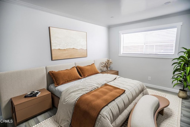 1925 Ginger St Unit 112, Oxnard, CA 93036 - bedroom with wood finished floors and ornamental molding