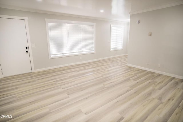 1925 Ginger St Unit 112, Oxnard, CA 93036 - unfurnished living room with ornamental molding, light wood-style floors, and recessed lighting