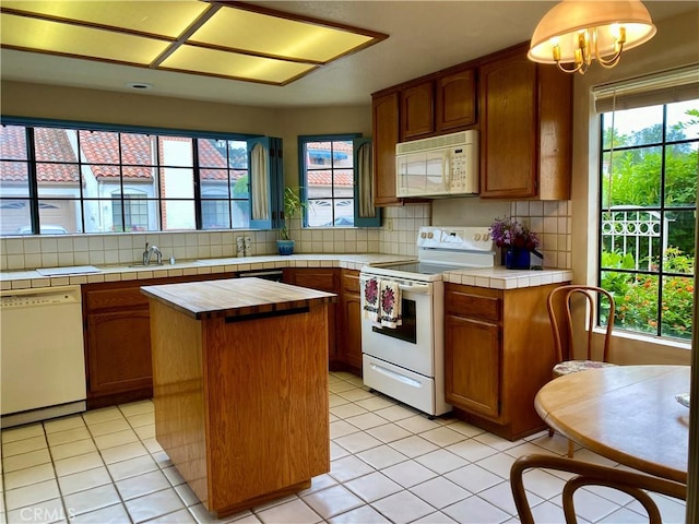 28432 Alava, Mission Viejo, CA 92692 - kitchen with white appliances, tasteful backsplash, light tile patterned floors, and plenty of natural light
