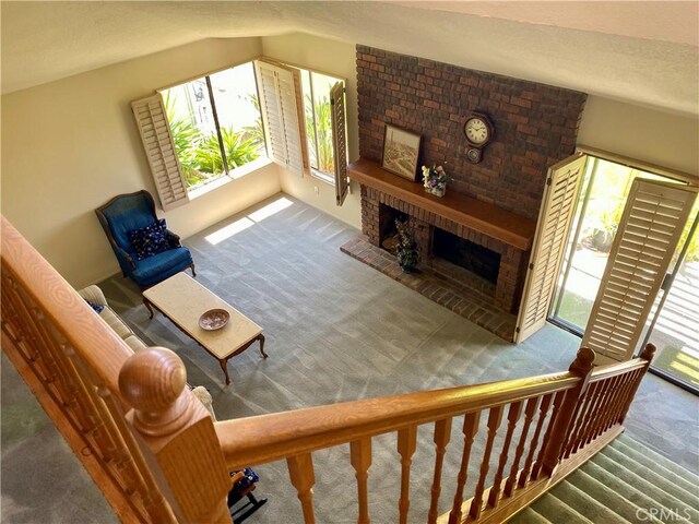 28432 Alava, Mission Viejo, CA 92692 - carpeted living room with a brick fireplace and lofted ceiling