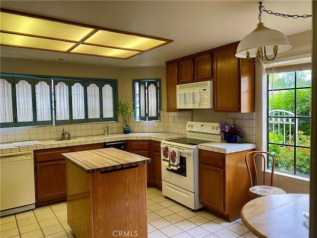 28432 Alava, Mission Viejo, CA 92692 - kitchen with white appliances, tasteful backsplash, light tile patterned flooring, and wooden counters