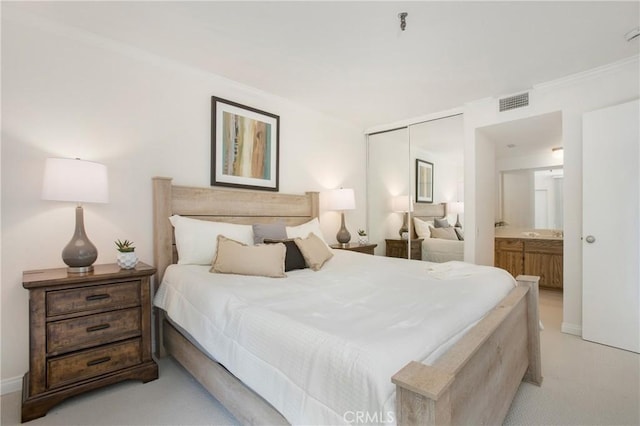 26701 Quail Crk Unit 31, Laguna Hills, CA 92656 - bedroom with light colored carpet, a closet, crown molding, and ensuite bathroom