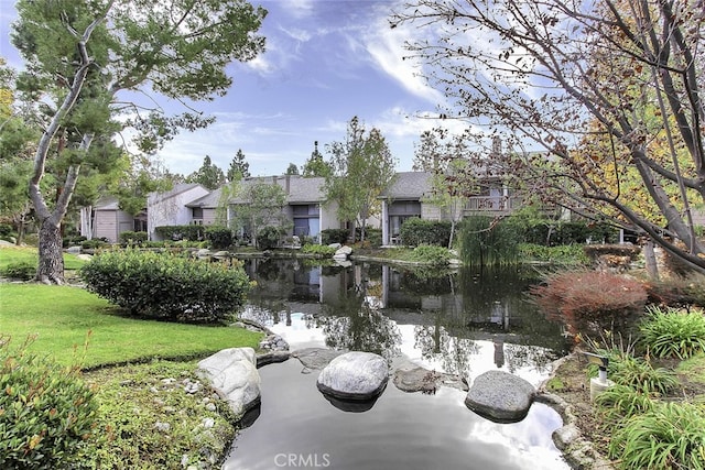 26701 Quail Crk Unit 31, Laguna Hills, CA 92656 - surrounding community featuring a lawn, a residential view, and a water view