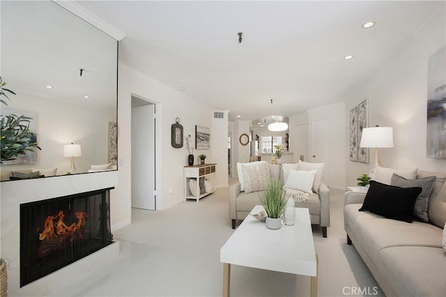 26701 Quail Crk Unit 31, Laguna Hills, CA 92656 - living room featuring light colored carpet, recessed lighting, and a warm lit fireplace