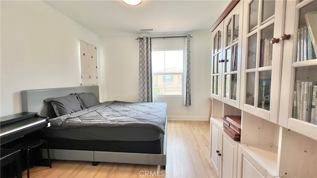 122 Espina, Irvine, CA 92620 - bedroom featuring light wood-type flooring and baseboards
