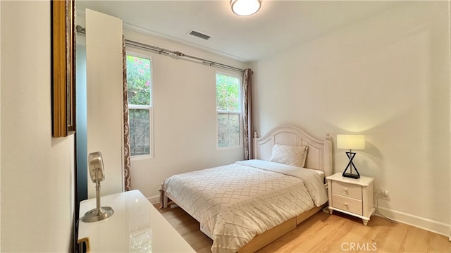 122 Espina, Irvine, CA 92620 - bedroom featuring light wood-style flooring and baseboards