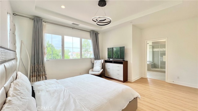122 Espina, Irvine, CA 92620 - bedroom featuring a raised ceiling, wood finished floors, connected bathroom, and recessed lighting