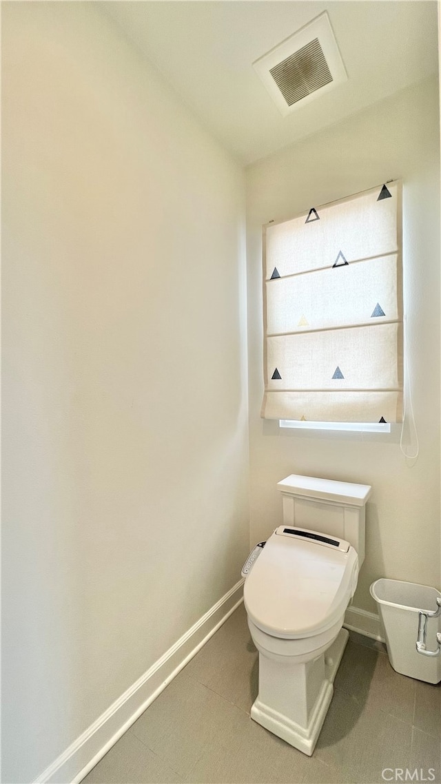 122 Espina, Irvine, CA 92620 - bathroom featuring toilet and baseboards