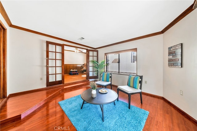 520 W Santa Clara Ave, Santa Ana, CA 92706 - sitting room featuring wood finished floors, ornamental molding, and ceiling fan