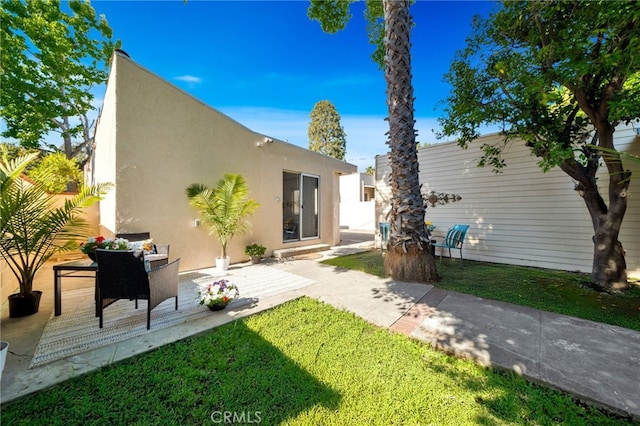 520 W Santa Clara Ave, Santa Ana, CA 92706 - back of house featuring a patio area, stucco siding, and a yard