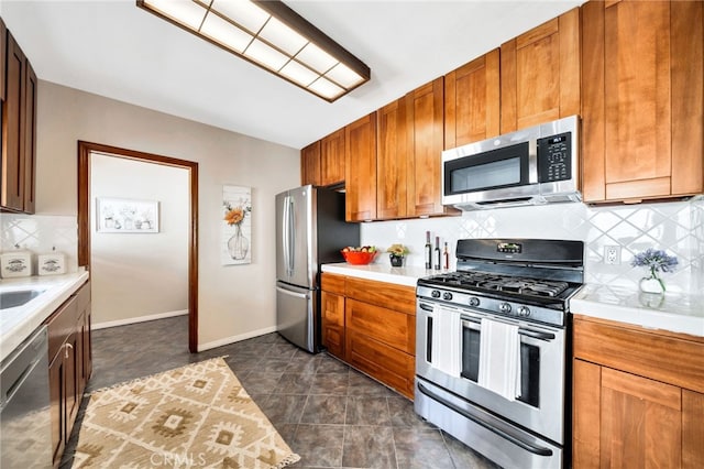 520 W Santa Clara Ave, Santa Ana, CA 92706 - kitchen with appliances with stainless steel finishes, light countertops, and decorative backsplash