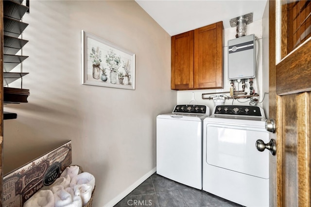 520 W Santa Clara Ave, Santa Ana, CA 92706 - laundry area with tankless water heater, cabinet space, separate washer and dryer, and dark tile patterned floors
