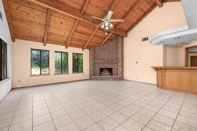 6710 Golden State Blvd, Madera, CA 93637 - unfurnished living room with a wooden ceiling with exposed beams, high vaulted ceiling, a brick fireplace, light tile patterned floors, and ceiling fan